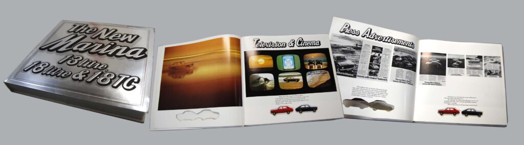 A brochure is spread out on a surface. There is a double-page feature on 'Television and Cinema' and another on 'Press Advertisement'. The pages are illustrated with multiple colour photos, below these text describes an advertisement campaign for a new car called the Marina.
