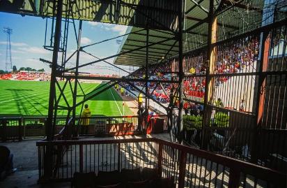 A restricted view from behind a floodlight pylon at the Town End of the County Ground, home of Swindon Town Football Club. 14 August 1994. 